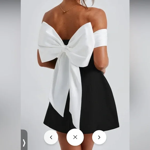 Elegant Black Women's Dress with White Bow
Small & Medium Available - Picture 2 of 8